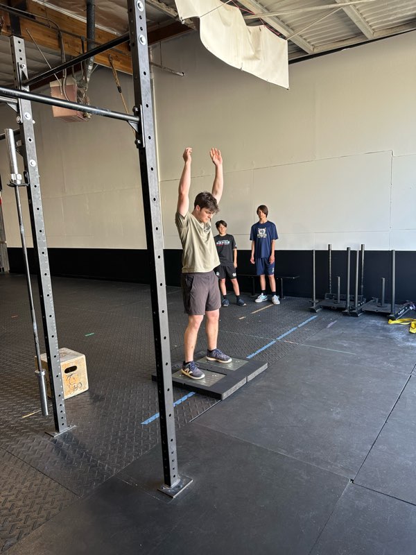 An athlete jumping on the force plates.